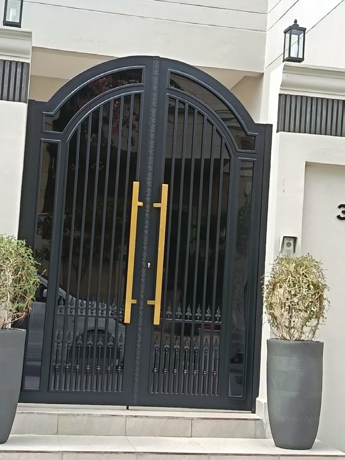 Decorative arched metal entrance gate
