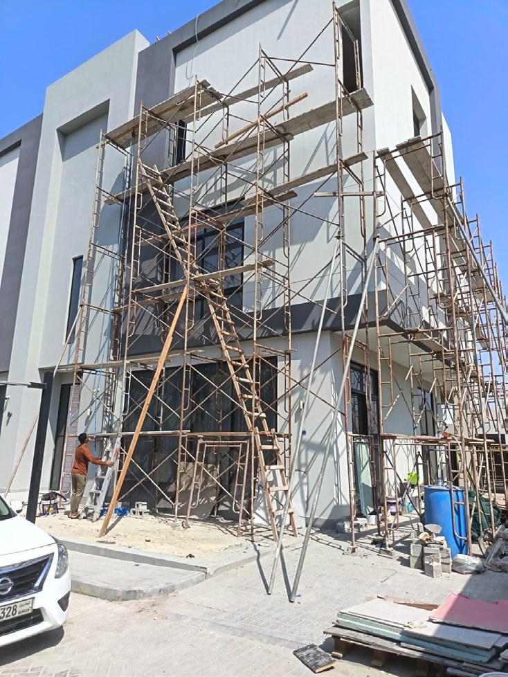 Building exterior during works with scaffolding