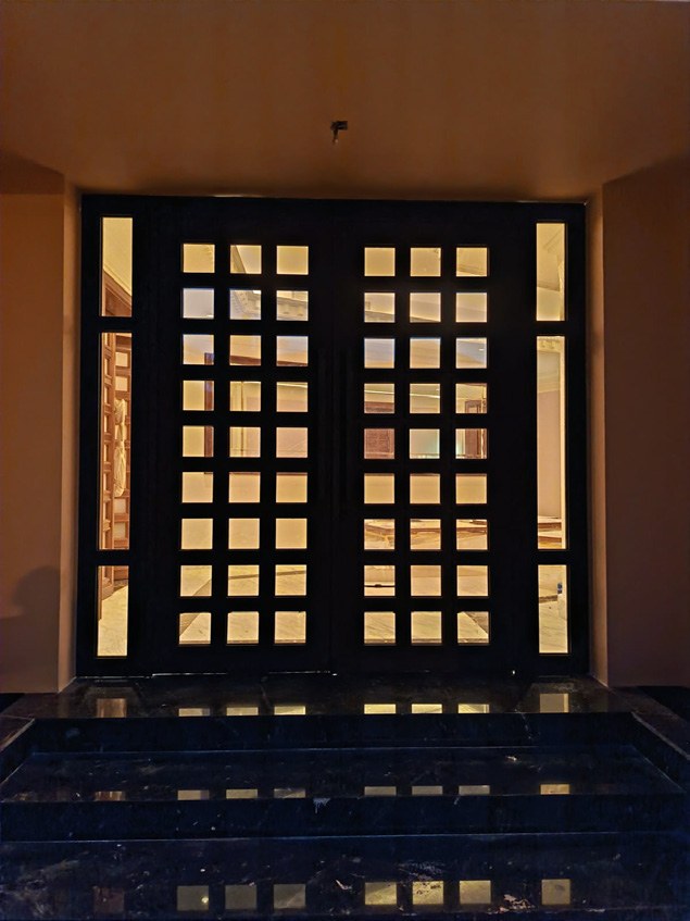 Timber entrance door with geometric panels